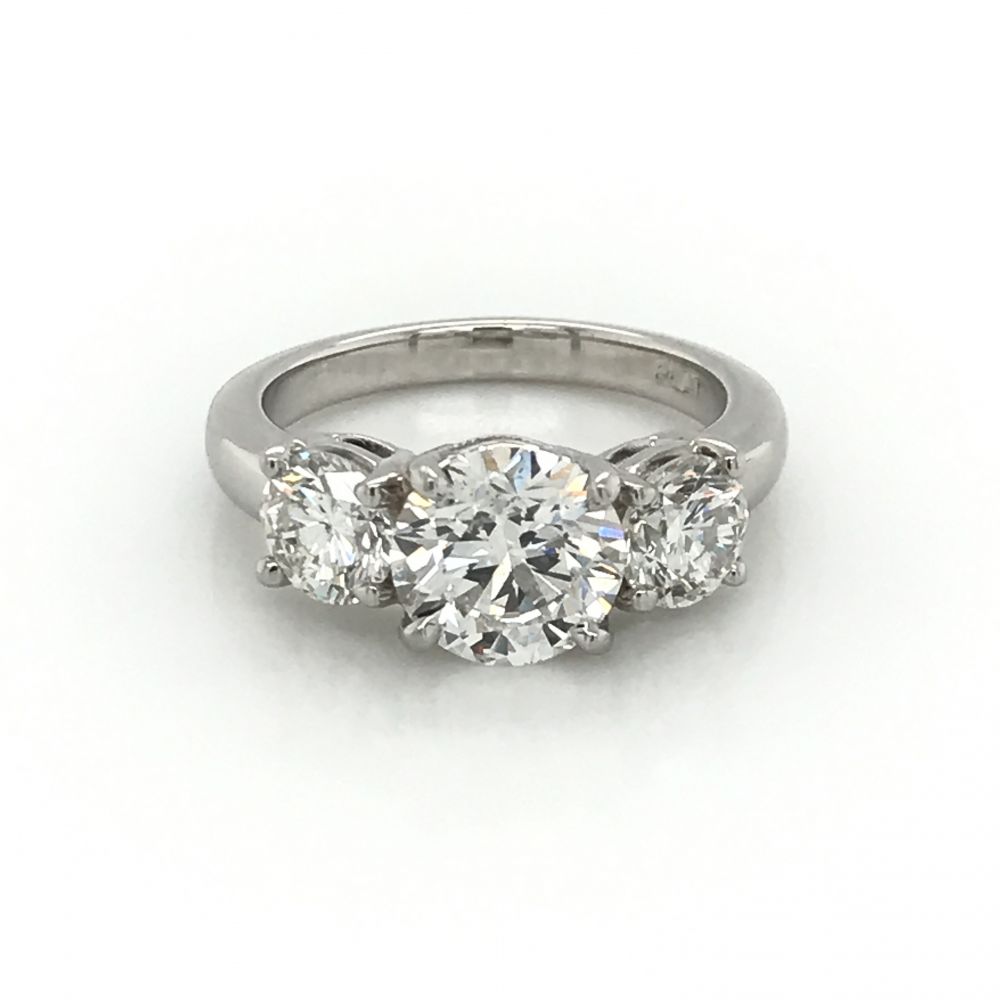 Tri stone hotsell engagement ring