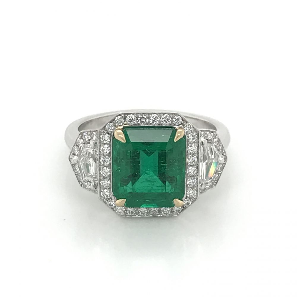 Emerald ring surrounded by diamonds shop